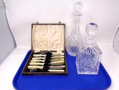 A tray containing two lead crystal decanters, one by J. G.