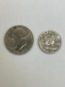 A United States 1954 half dollar together with a one dollar.