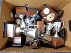 A box of plated trophies