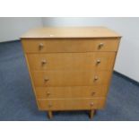 A mid-20th century four drawer chest.