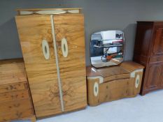 A mid century walnut veneered double door wardrobe with matching dressing chest