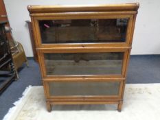An Edwardian oak three-section stacking bookcase