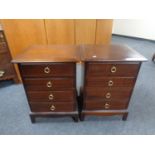 A pair of Stag Minstrel four drawer bedside chests.