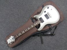 A PRS SE Standard electric guitar in carry bag.