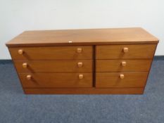 A teak six drawer block chest.