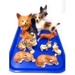 A tray containing nine assorted ceramic animal ornaments including Russian tiger and lion cubs,