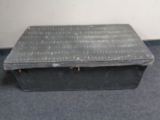 An early 20th century wicker trunk upholstered in canvas.