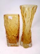 Two 20th century moulded amber glass bark vases in the style of Whitefriars.