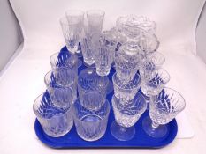 A tray containing assorted glassware including lead crystal whisky glasses, wine glasses and flutes,