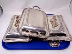Three silver plated entrée dishes with covers.