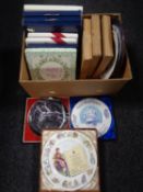 A box containing assorted collector's plates and wall plaques including Wedgwood, Royal Doulton etc.