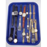 A tray containing assorted lady's and gents wristwatches including Timex,