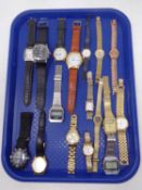 A tray containing assorted lady's and gents wristwatches including Timex,