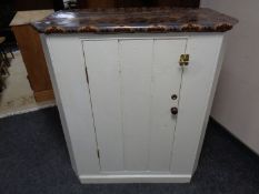 A shaped painted pine cabinet