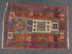 A Caucasian prayer rug 124cm by 85cm