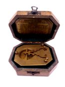 A reproduction F Cox of London brass sundial compass in fitted box.