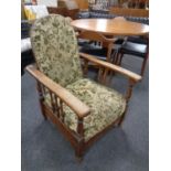 A 20th century oak framed adjustable armchair.