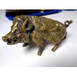 A heavy brass ornament of a wild boar.