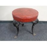 A pub stool on cast iron legs.