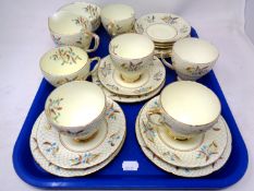 A tray containing a 20 piece Royal Grafton Autumn Lace bone china tea service.