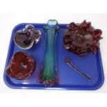 A tray containing four pieces of art glass including, a vase, two bowls and a mortar and pestle.
