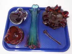 A tray containing four pieces of art glass including, a vase, two bowls and a mortar and pestle.