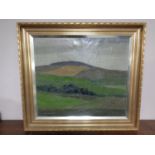 A Carlo Woonsen oil-on-canvas landscape scene in a gilt frame.