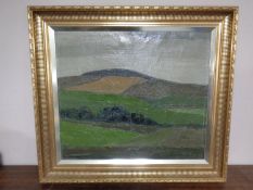A Carlo Woonsen oil-on-canvas landscape scene in a gilt frame.