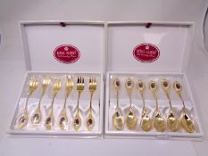 Two boxed sets of six Royal Albert Old Country Roses gold plated teaspoons and cake forks.