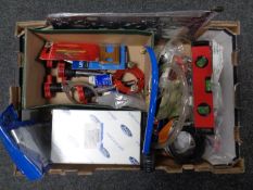 A box containing spirit level, compressor attachments, spirit level, car parts, jigsaw blades etc.