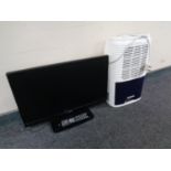 A Logik 21 inch TV DVD with remote together Meaco dehumidifier.