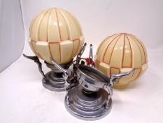 Two Art Deco chrome table lamps with glass shades.