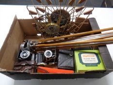 A box containing assorted vintage cameras, camera tripod,