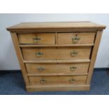 An Edwardian satinwood five drawer chest.