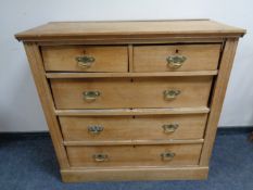 An Edwardian satinwood five drawer chest.