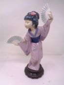A Lladro figure - Geisha with hand fans.