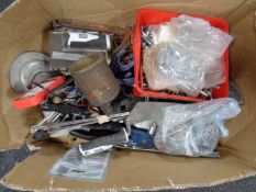 A box of assorted hand tools, hardware,