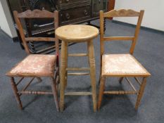 A pair of Edwardian satinwood bedroom chairs together with a pine stool.