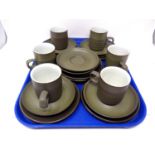 A tray containing six Denby coffee trios.