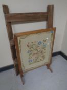 An Edwardian tapestry fire screen together with a rustic pine folding clothes airer.
