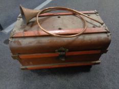 A tin trunk and a copper and brass hunting horn.