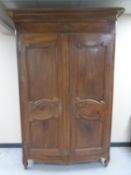 A French walnut double door armoire.