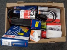 A box containing car parts by Bosch, Motorcraft, Schaeffler including air filters, oil filters,