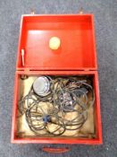 A vintage case containing chrome microphones