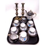 A tray of antique brass candlesticks together with a Japanese tea service