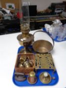 A tray containing antique and later metalware including an Aladdin brass oil lamp with chimney,