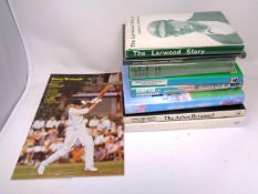 Nine cricket books bearing signatures including Harold Larwood, Richie Benaud, Fred Trueman,