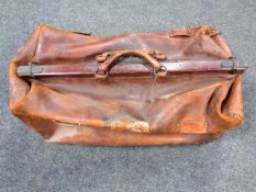 An oversized leather Gladstone bag.