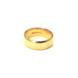 A 22ct gold band ring, size J CONDITION REPORT: 7.