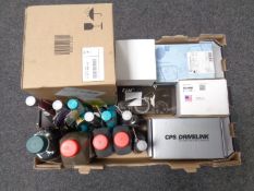 A box containing Petronas engine products, brake fluid, car parts etc.